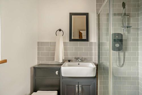 a bathroom with a sink and a shower at 3 Bed in Defynnog oc-p33133 in Devynock