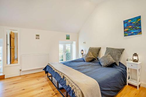 a bedroom with a large bed with blue sheets at 3 Bed in Defynnog oc-p33133 in Devynock
