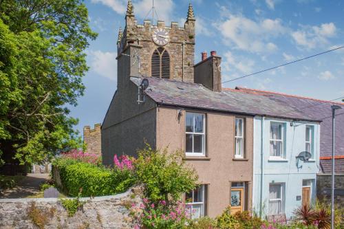 an old house with a clock tower on top of it at 2 Bed in Beaumaris oc-wai218 in Beaumaris