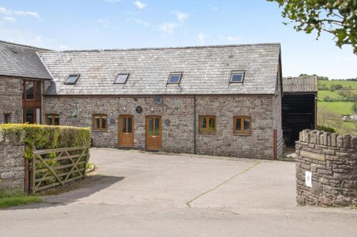 an external view of a stone building with a barn at 2 Bed in Cray oc-bow287 in Cray
