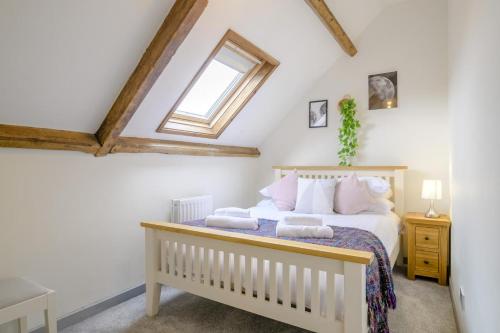 a bedroom with a bed and a skylight at 2 Bed in Cray oc-bow287 in Cray