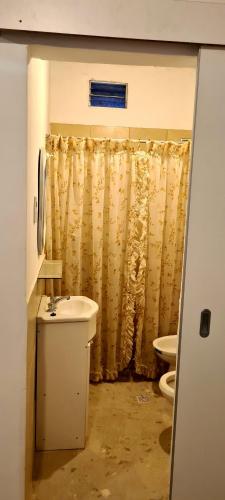 a bathroom with a sink and a toilet at Tres Hermanos in Trinidad