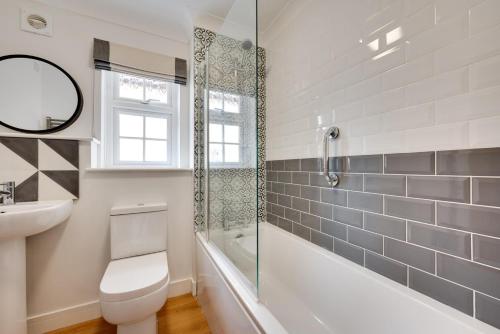 a bathroom with a toilet and a sink and a shower at 2 Bed in Walberswick oc-5mart in Walberswick