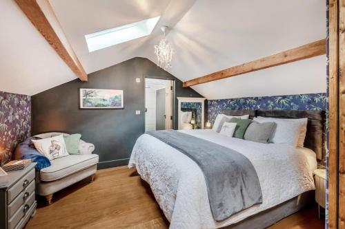 a bedroom with a large bed and a skylight at 1 Bed in Askrigg oc-c33109 in Askrigg