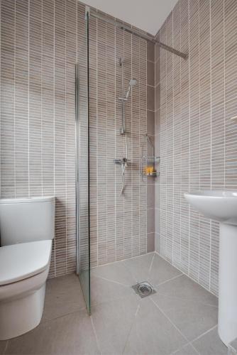 a bathroom with a shower and a toilet and a sink at 2 Bed in Holt oc-2274 in Holt