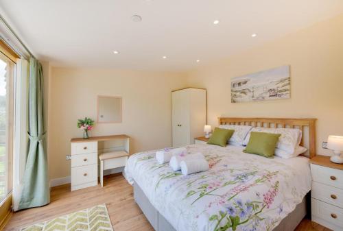 a bedroom with a large bed and a window at 1 Bed in Llanrwst oc-wag696 in Llanrwst