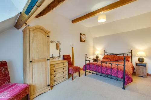 a bedroom with a bed and a dresser at 3 Bed in Builth Wells oc-wal257 in Maesmynis
