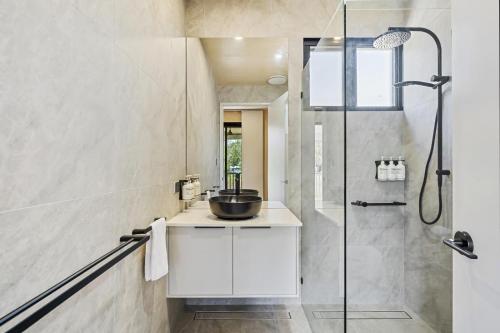 a bathroom with a sink and a shower at Ingenia Holidays Kinka Beach Yeppoon in Kinka