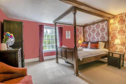 a bedroom with a canopy bed and a window at 5 Bed in Bramfield oc-sftmh in Bramfield