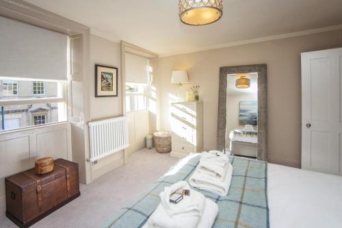a room with a pile of towels on a floor at 1 Bed in Bath oc-bhr48 in Bath