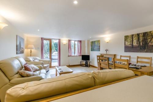 a living room with a couch and a table at 2 Bed in Smallburgh oc-g33735 in Dilham