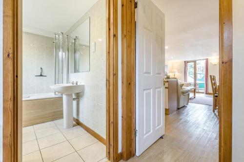 a bathroom with a sink and a shower at 2 Bed in Smallburgh oc-g33735 in Dilham