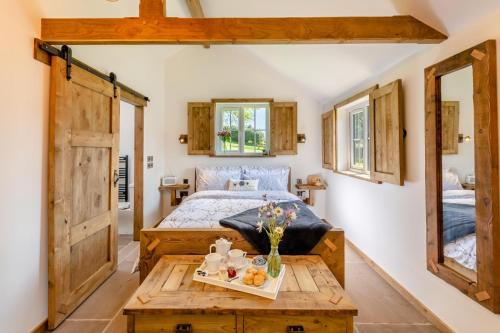 a bedroom with a bed and a table with food on it at 1 Bed in Okehampton oc-p29017 in Okehampton