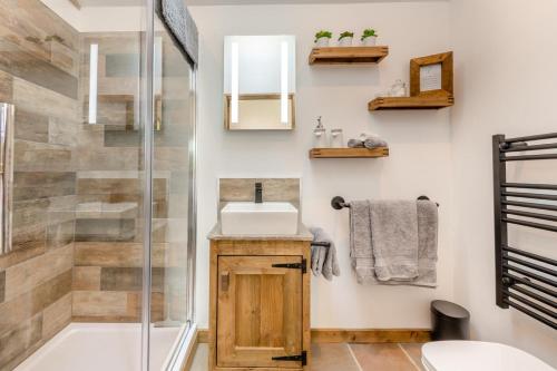 a bathroom with a sink and a shower at 1 Bed in Okehampton oc-p29017 in Okehampton