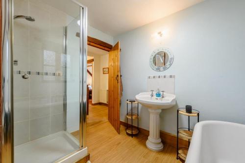 a bathroom with a shower and a sink at 3 Bed in Manorbier oc-pw270a in Manorbier