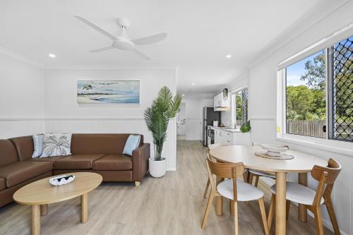 a living room with a couch and a table at Ingenia Holidays Kinka Beach Yeppoon in Kinka