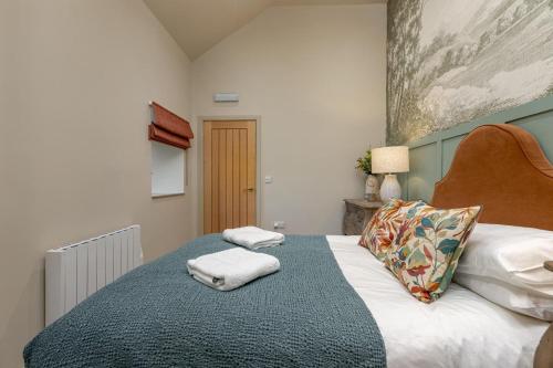 a bedroom with a bed with two towels on it at 1 Bed in Wycliffe oc-t29946 in Wycliffe