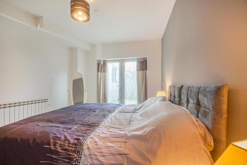 a large bed in a room with a window at 1 Bed in Nefyn oc-n28983 in Nefyn