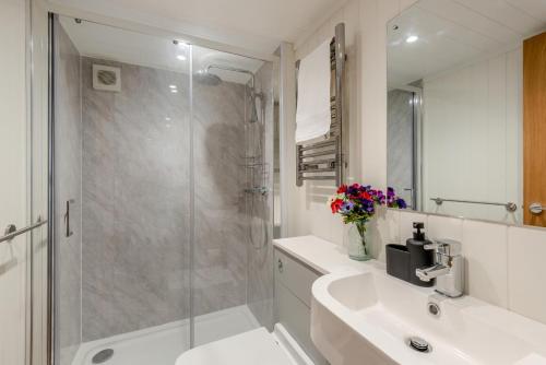 a bathroom with a shower and a sink and a toilet at 2 Bed in Mouswald oc-b33444 in Mouswald