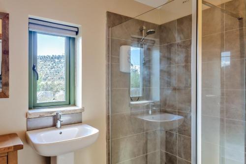 a bathroom with a sink and a shower at 1 Bed in Bracewell oc-l33325 in Bracewell