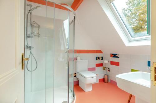 a bathroom with a shower and a toilet and a sink at 1 Bed in Clatcombe oc-s33309 in Castletown