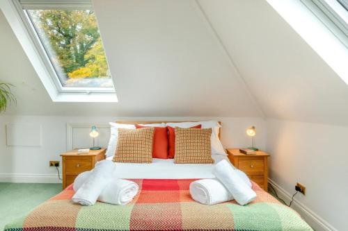 a bedroom with a bed with pillows and a window at 1 Bed in Clatcombe oc-s33309 in Castletown