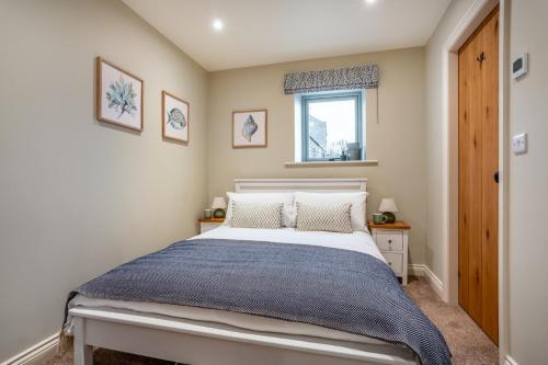 a bedroom with a bed and a window at 2 Bed in Castleton oc-p34012 in Castleton