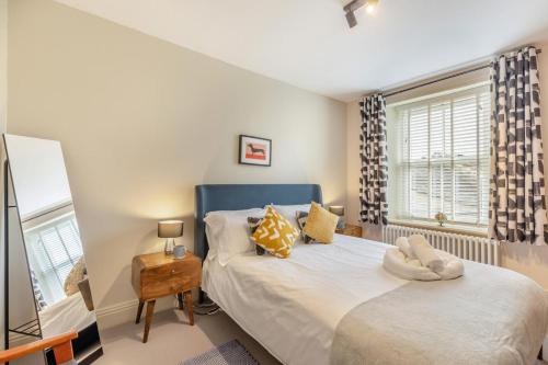 a bedroom with two beds and a window at 3 Bed in Carperby oc-ds058 in Carperby