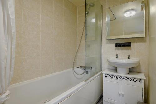 a bathroom with a sink and a toilet and a shower at 2 Bed in Dennington oc-b28010 in Dennington