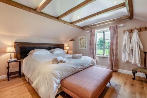 a bedroom with a large bed with two towels on it at 1 Bed in Tollard Royal oc-t29453 in Tollard Royal