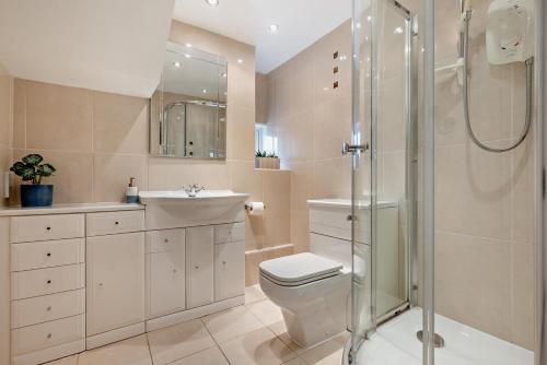 a bathroom with a shower and a toilet and a sink at 3 Bed in Treknow oc-h29194 in Treknow