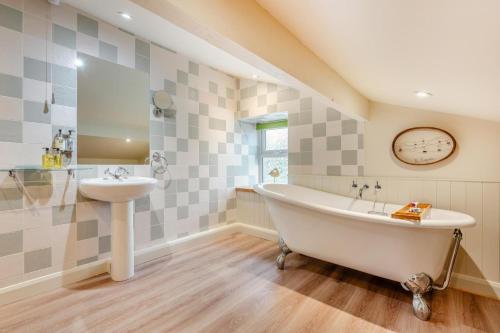 a bathroom with a sink and a bath tub and a sink at 3 Bed in Appersett oc-ds944 in Appersett