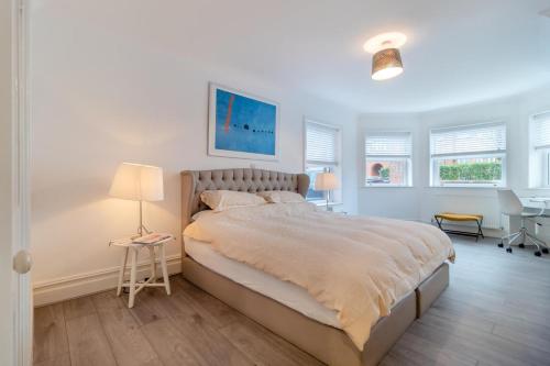 a bedroom with a large bed and a desk at 2 Bed in Felixstowe oc-m30281 in Felixstowe