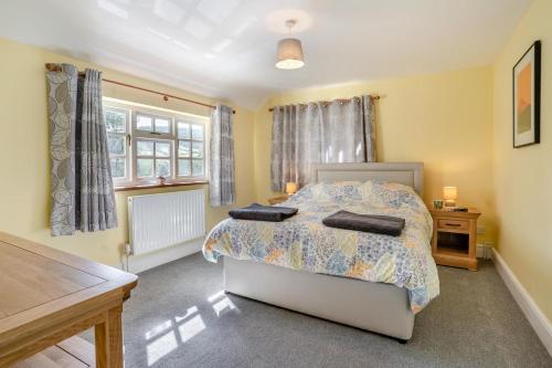 a bedroom with a bed with two pillows on it at 3 Bed in Scethrog oc-h30013 in Scethrog