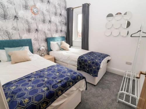 a bedroom with two beds and a window at 3 Bed in Ripon oc-t33753 in Ripon