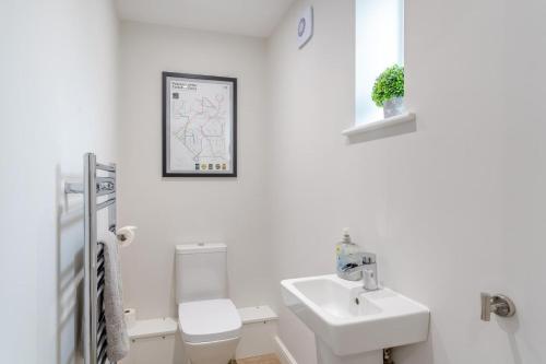 a white bathroom with a toilet and a sink at 3 Bed in Middlesmoor oc-w30366 in Middlesmoor