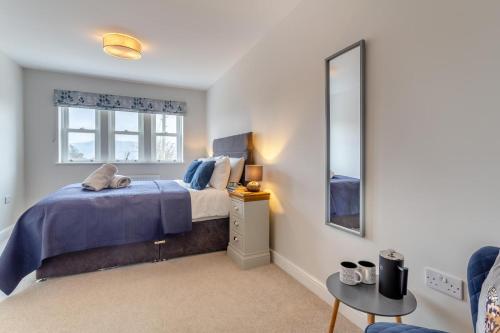 a bedroom with a bed and a mirror at 3 Bed in Middlesmoor oc-w30366 in Middlesmoor