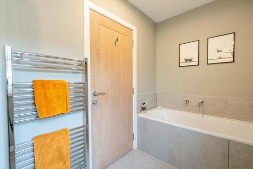 a bathroom with a bath tub and a bath tub at 2 Bed in Dunkeld oc-i30992 in Dunkeld