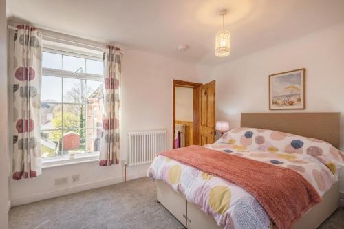 a bedroom with a bed and a window at 2 Bed in Lowestoft oc-c31866 in Lowestoft