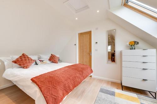 a white bedroom with a bed and a dresser at 1 Bed in Booton oc-2266 in Cawston