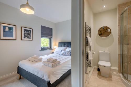 a bedroom with a bed with towels on it at 2 Bed in Mundesley oc-r31875 in Mundesley