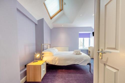 a small bedroom with a bed and a window at 1 Bed in Tenby oc-w28986 in Tenby