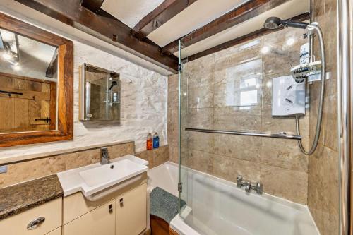 a bathroom with a sink and a shower at 3 Bed in Fucheswen oc-c29607 in Blaenau-Ffestiniog