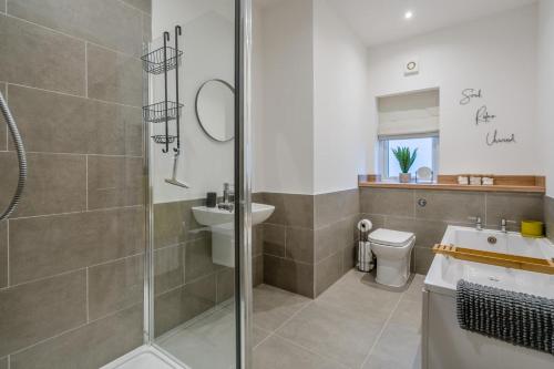 a bathroom with a shower and a sink and a toilet at 3 Bed in Fearnan oc-s29984 in Chesthill