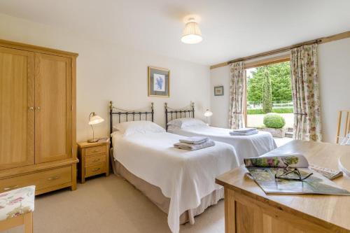 a bedroom with two beds and a window at 2 Bed in Little Hereford oc-l29580 in Berrington