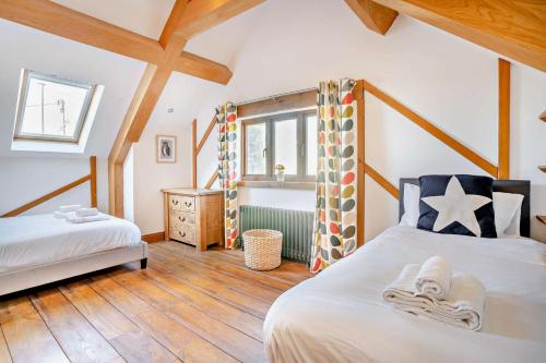 a bedroom with two beds and a window at 4 Bed in Nottage oc-t28401 in Nottage