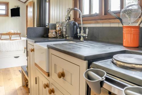 a kitchen with a sink and a stove at 1 Bed in Bronllys oc-t31949 in Bronllys