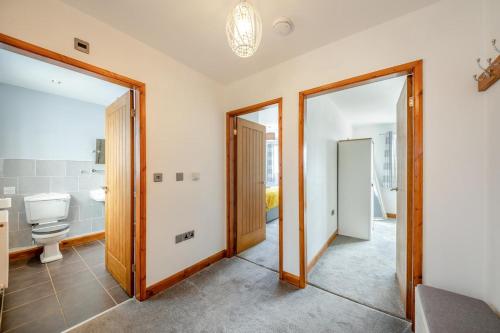 a bathroom with two mirrors and a toilet at 2 Bed in Pickering oc-d32743 in Pickering