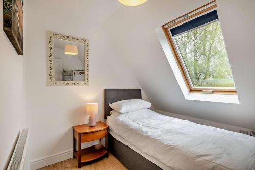 a small bedroom with a bed and a window at 2 Bed in Eccles oc-l27507 in Eccles