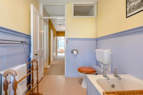 a bathroom with a toilet and a sink at 3 Bed in Swanage oc-s30316 in Swanage